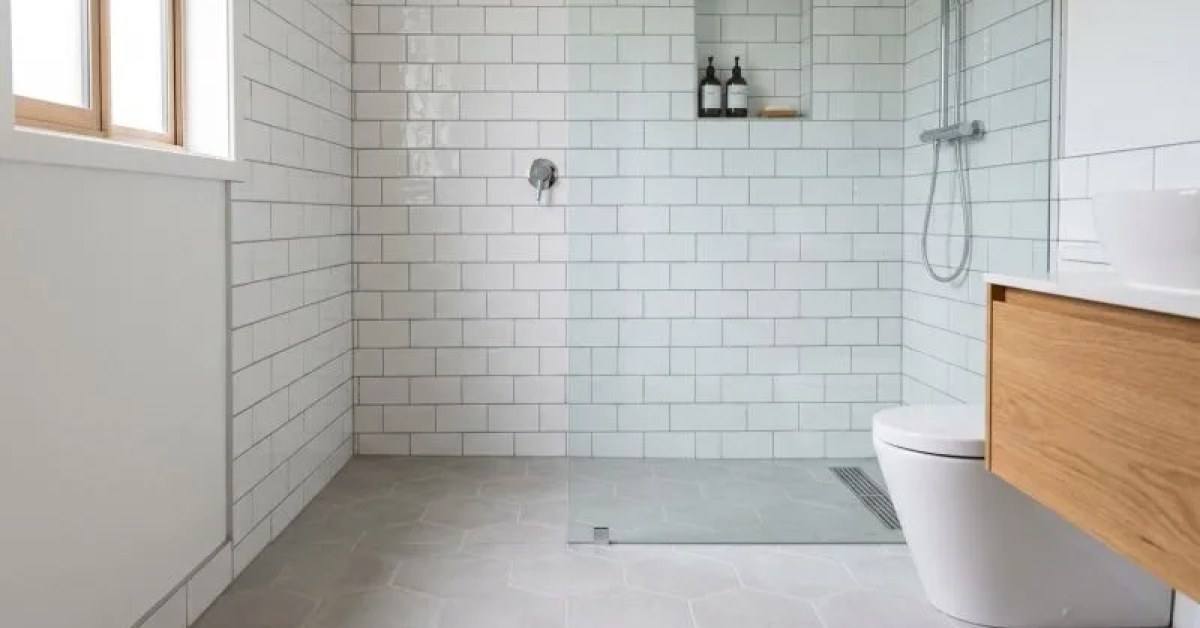Newly installed bathroom tile on shower walls and floor