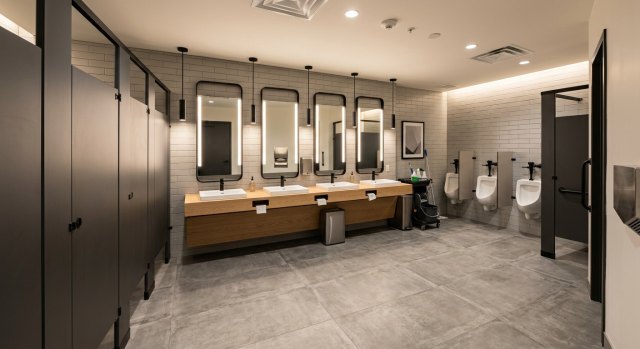 Clean bathroom remodeling project with a vanity, tub, and storage